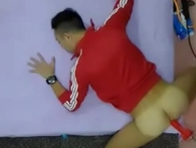 Red fun with buttmachine and dildo in gay Asian video.
