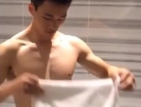Steamy scene of a fit hunk washing his cock in Taiwan