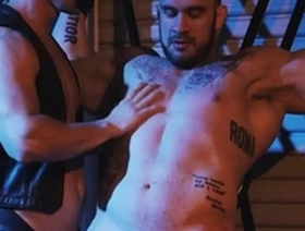Muscular hunk Devin Franco submits to dominant leather-clad Davin Strong in a fiery fisting encounter