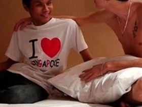 Two young men of Asian and Arab descent give each other pleasure
