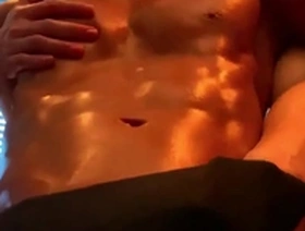 Muscular Asian man enjoys nipple play.