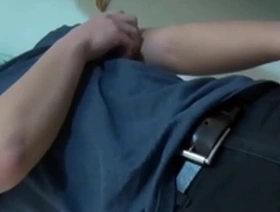 A seductive and adorable Asian boy undresses and pleasures his impressively large penis individually