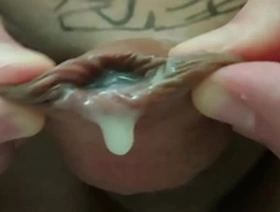 Masturbating with a shaved and fatty pussy and an uncut foreskin.