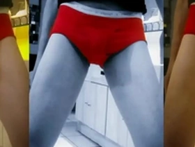 Slender mature man flaunts his throbbing member in seductive red pantyhose