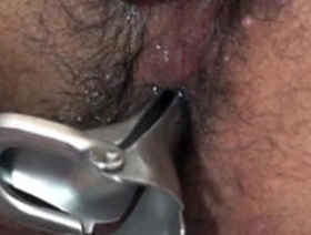 Young Asian man gets his ass teased with a sex toy by a doctor in a medical uniform.