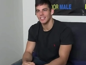 A single, attractive man with a tattoo masturbates during an audition