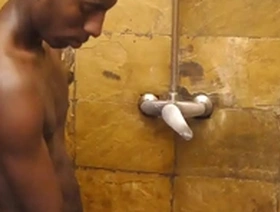 African beauty gives blow job in the shower and then has doggy style sex.