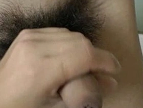 Young and handsome Asian boy gives a handjob while being tied up.