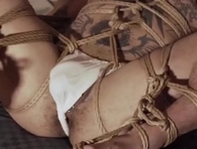 Yoshi Kawasaki, a gay Asian hunk, in hardcore fetish bondage and tattoo scenes.