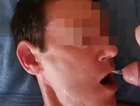An amateur gay video of an Asian twink drinking piss.