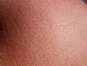 Petite Asian girl shows off her big ass after tanning herself.