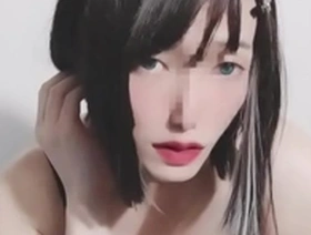 Cross dressing Japanese beauty in female attire