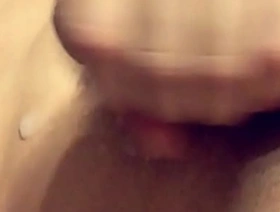 Asian man masturbates and has an orgasm with a stream of semen on his washboard stomach.